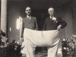 Drs David Duncan Main and Stephen Douglas Sturton trying on sample pyjamas at CMS Hospital, Hangzhou