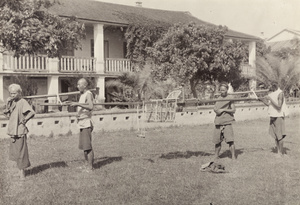 Four bearers with Dr J.P. Maxwell's chair, Zhangpu, Fujian