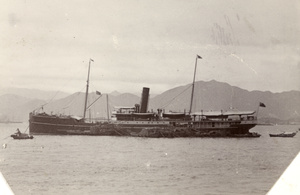 Lighters laden with sacks by a British freighter, Hong Kong harbour