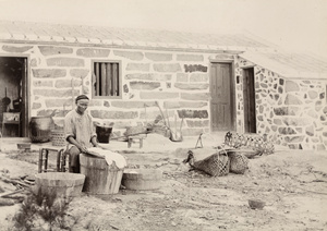 Man washing laundry, Toa Bo, near Zhangpu