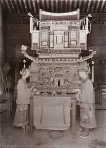 Paper figures and a paper pavilion to be burnt at a funeral