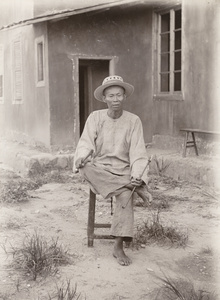 Head stone mason at the hospital building site, Yongchun