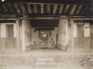 A man reading in an open Christian meeting room, Dehua, Fujian province