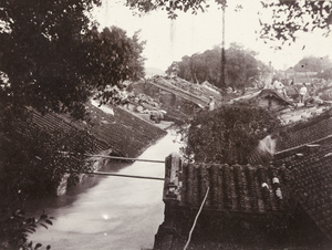 People on the roofs of houses during very high flooding