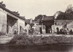 Laundry and plants drying in the courtyard of a house