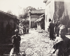 A foreign man wearing a pith helmet, in a street, Thai Jong, near Shantou