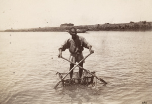 A man crossing a river on a raft