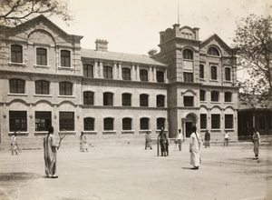 Playing tennis on the courts at Peking Union Medical College, Beijing