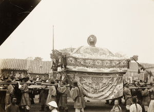 Bearers carrying a catafalque in a funeral procession, Beijing