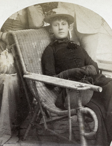 Clare Hillier in a rattan chair, Balizhuang, Beijing