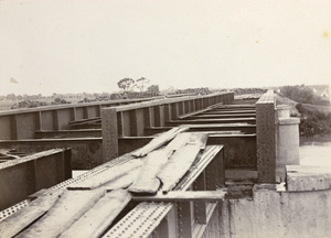 Railway bridge, stripped of rails and barricaded, Tientsin