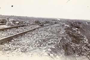 Torn-up rails and stone rifle pits on the Peking line, Tientsin