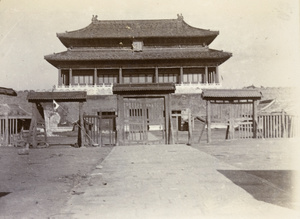 Palings and Japanese flag near to a gate of Forbidden City, Peking