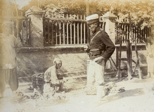 A soldier with a fruit and vegetable pedlar