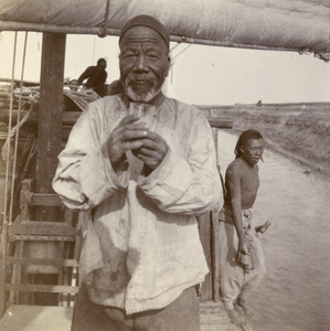 The lao-pan (skipper or captain) and members of his crew