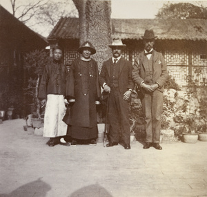 A Chinese judge in his garden, with Lockhart and Barnes