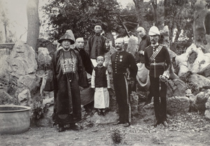 Lockhart and Barnes with General Tien and his grandson, at General Tien's residence, Yen-Chou-Fu
