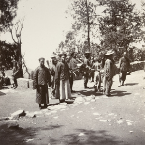 Bearers and attendants, during ascent of Mount Tai 泰山, Shandong