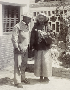 The British Commissioner posing with General Mei and his pocket watch