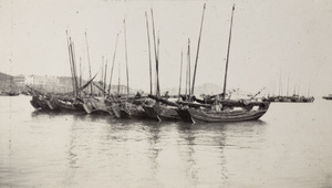 Junks in harbour, King's Hotel in background