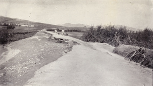 Bicycles by a flood damaged road, Weihaiwei