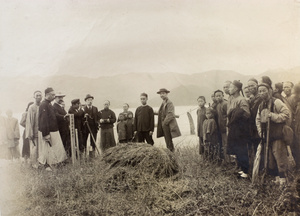 Stewart Lockhart and Wang Cunshan (王存善) fixing the first boundary mark on the shore at Stanley Inlet, Hong Kong