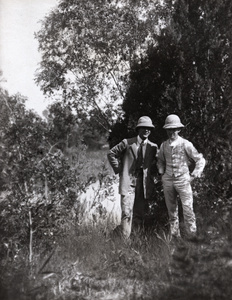 Two men among trees