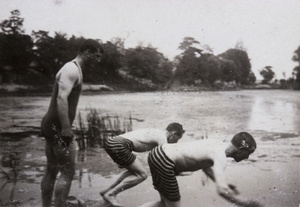 Oliver Heywood Hulme and two other men diving