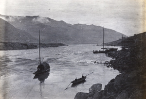 Boats on a river, beside rapids