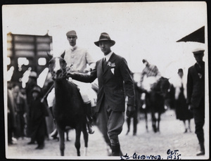 Man leading the racehorse 'Goodwood'