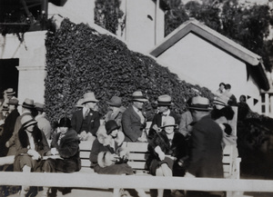 Group in an enclosure at the races