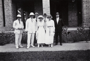 Oliver Heywood Hulme and party in front of a house