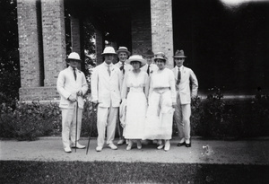 Oliver Heywood Hulme and party in front of a house