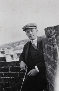 A man standing on a city wall