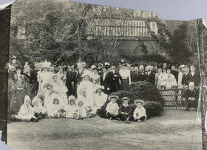 A wedding reception group, in a garden