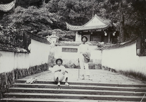 Two men by a temple