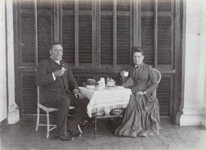 Mr. & Mrs. Woodley taking afternoon tea
