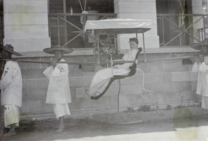 Mrs Richard in a sedan chair