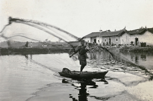 Fisherman casting his net