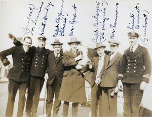 Naval and other personnel, with a mascot