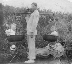 Harold Peck larking about with panniers