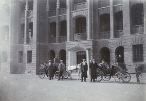 Six Europeans and two carriages outside Gordon Road Police Station, Shanghai