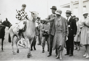 Sir Miles and Lady Rachel Lampson, with a jockey and horse, Peking Races, Beijing