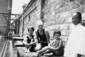 Ann Phipps, with an amah and children, at the American Legation Guard Pool, Beijing