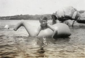 Graham Lampson with a swimming float (horse), Beidaihe