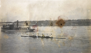 Rowing behind a launch, with race spectators