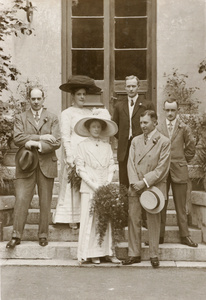 A wedding couple, with guests