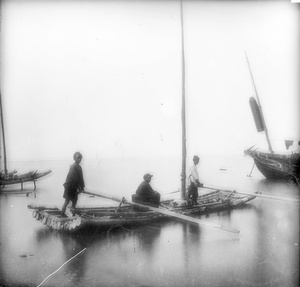 A raft boat and three fishermen