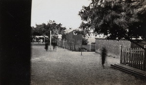 A road near an unidentified railway station