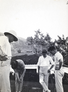 Playing golf, Sassoon Road, Hong Kong